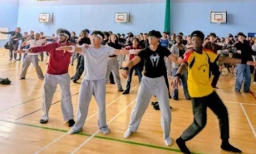 Sixth Form students leading the dance session in the Sports Hall